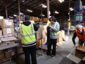 Sorting and packing school uniforms at DIK.