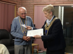 DG Julie presents President Noel with the Bill King Recognition Award